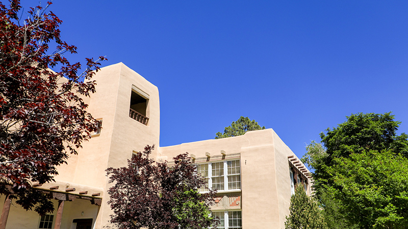 stucco building exterior with blue sky